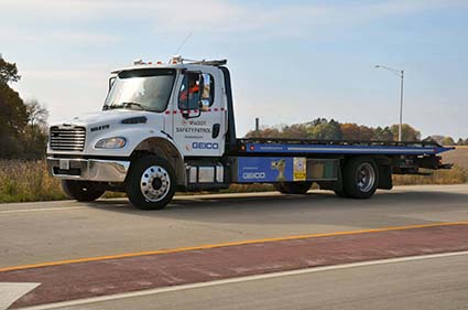 A white tow truck, says WisDOT Safety Patrol on the door.