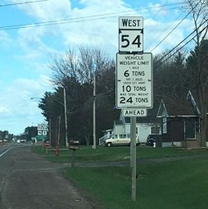 Posted road restrictions sign