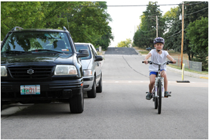 Bicyclist 3 feet away from parked car