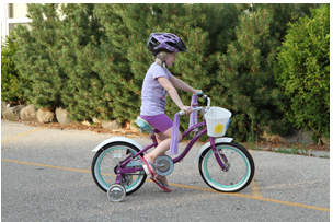 Bicycle rider with inappropriate footwear.