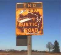 Damaged Rustic Road Sign